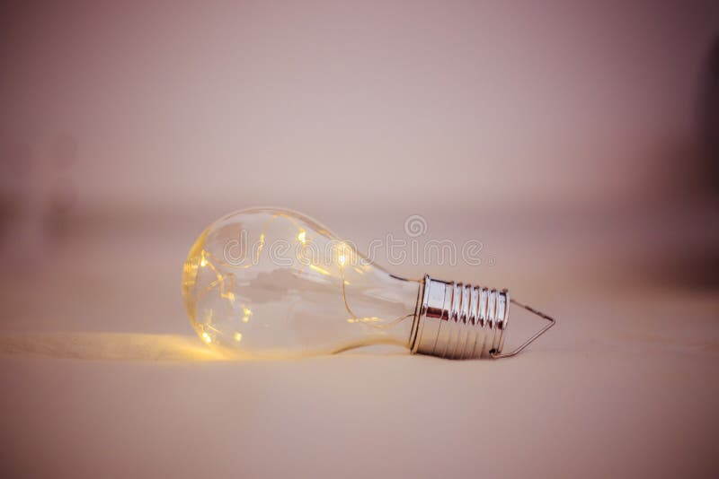 Ideas and Innovation Light Bulb with LEDs is Lying in the Bed Stock