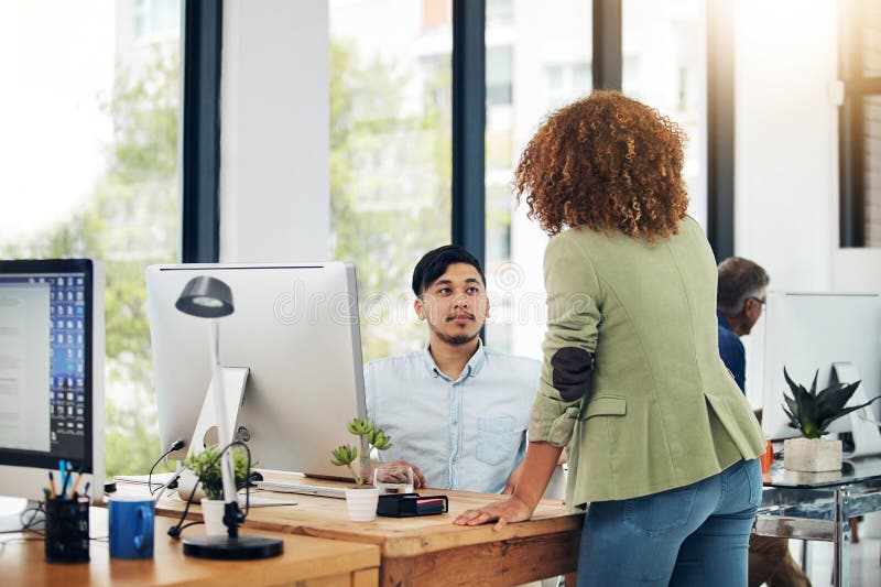Ideas are for Sharing in this Office. Two Creative Colleagues Working