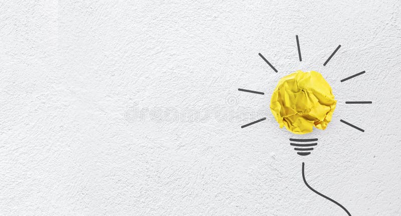 Ideas with yellow paper crumpled ball on wall background