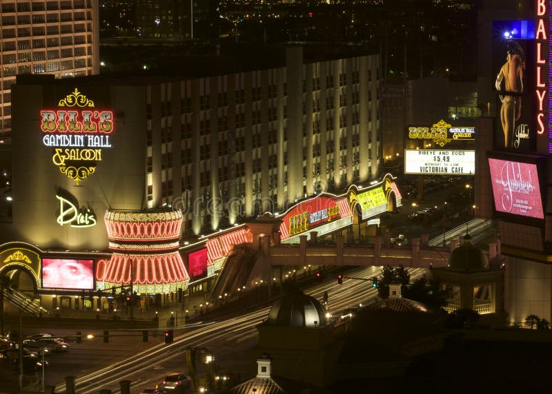 A night shot taken from the Bellagio hotel of a road junction on the famous Strip through Las Vegas. There are neon signs and adverts on the walls of the buildings. The traffic headlights are blurred due to a long exposure. A night shot taken from the Bellagio hotel of a road junction on the famous Strip through Las Vegas. There are neon signs and adverts on the walls of the buildings. The traffic headlights are blurred due to a long exposure.