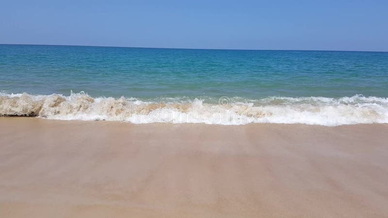 Idyllic crystal beach wave seawater in front of luxury hotel, attractive clear sea, nature coastline backgrounds during holidays