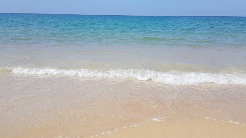 Idyllic crystal beach wave seawater in front of luxury hotel, attractive clear sea, nature coastline backgrounds during holidays