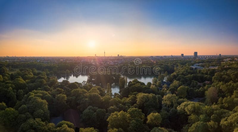An idyllic park in the Englischer Garten of Munich with a beautiful lake in an aerial view. stock images An idyllic park in the Englischer Garten of Munich with a beautiful lake in an aerial view. stock images