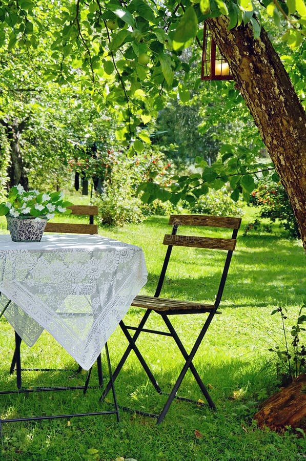 Idyllic setting of a table and wooden chair