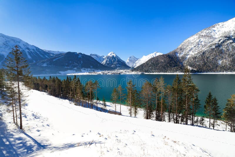 Idyllic snow landscape with mountain lake, Achenlake, Achensee, Austria