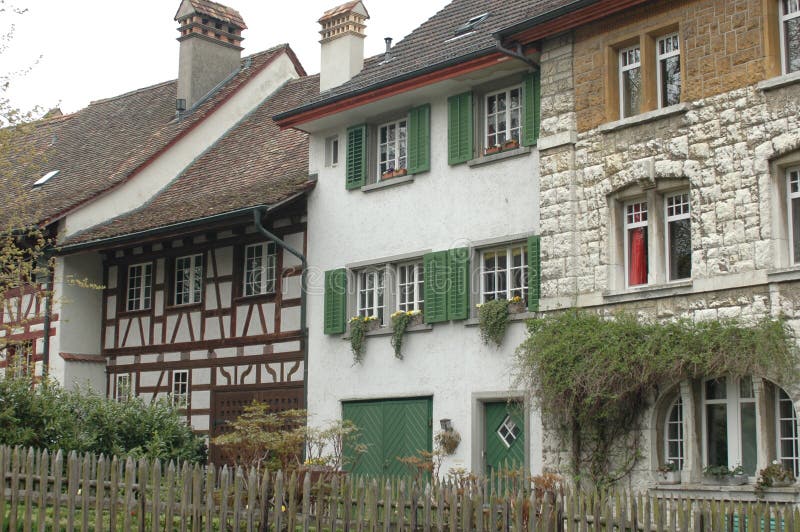 idyllic-swiss-village-wood-work-shutters-flowerboxes-historical-houses-switzerland-stonework-medieval-houses-traditional-64934991.jpg