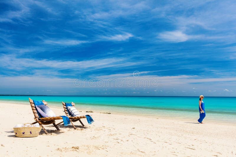 Idyllic tropical beach with white sand, turquoise ocean water and blue sky in Mozambique Africa. Idyllic tropical beach with white sand, turquoise ocean water and blue sky in Mozambique Africa