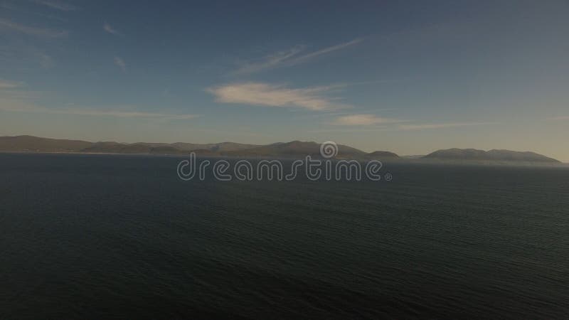 Idyllic view of sea against sky stock image