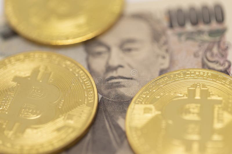 Japanese Yen and bitcoins are pictured on July 02, 2019, Tokyo, Japan. Japanese Yen and bitcoins are pictured on July 02, 2019, Tokyo, Japan