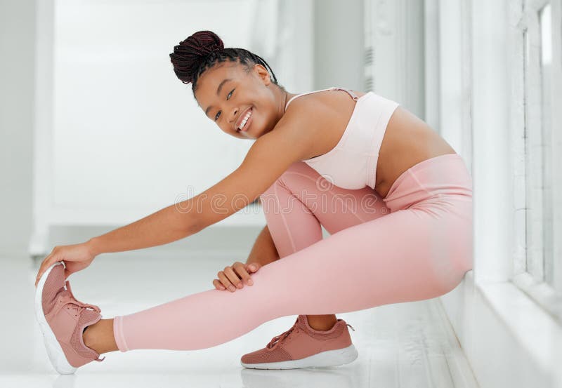 Woman Stretching at the Gym · Free Stock Photo