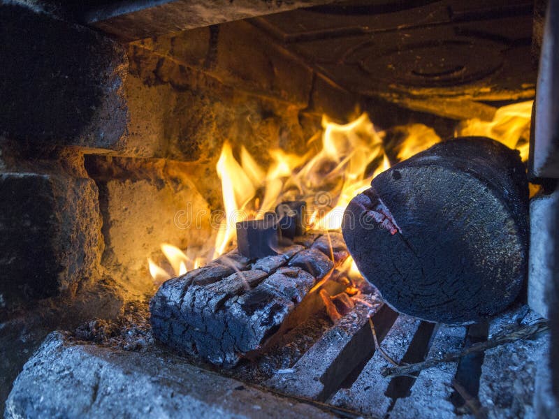 Ignition of Cubic Coals for a Hookah in a Woodburning Stove Stock