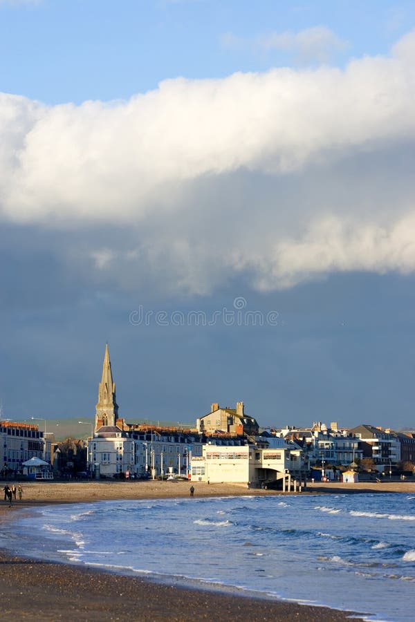 Weymouth Church and steeple in Dorset, Southern England on a sunny, stormy day by the beach. Weymouth Church and steeple in Dorset, Southern England on a sunny, stormy day by the beach