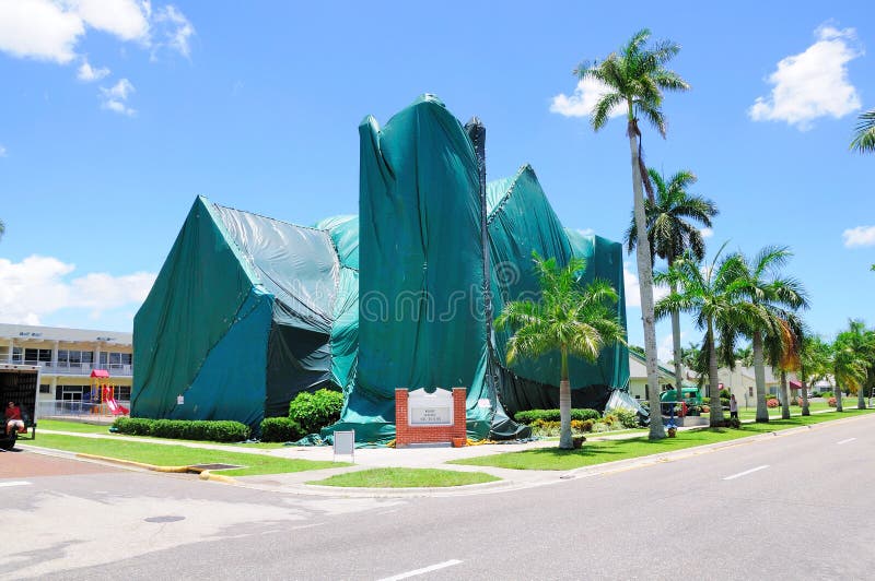 A church is tented with bgreen vinyl covers prior to a pest control fumigation. A church is tented with bgreen vinyl covers prior to a pest control fumigation