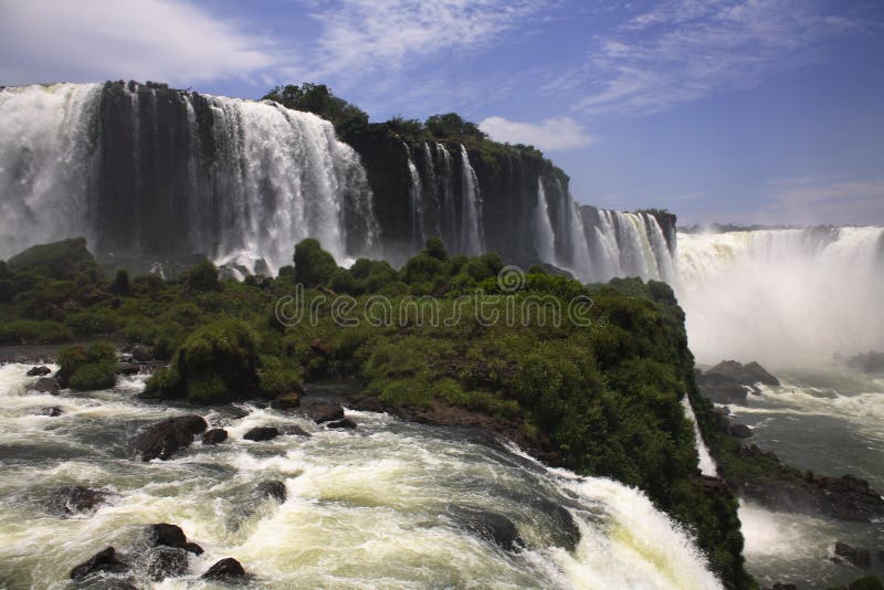 Iguassu (Iguazu; Iguaçu) Falls - Large Waterfalls. The Iguassu (or Iguazu) Falls is one of the largest masses of fresh water on the planet and divides, in South stock photos Iguassu (Iguazu; Iguaçu) Falls - Large Waterfalls. The Iguassu (or Iguazu) Falls is one of the largest masses of fresh water on the planet and divides, in South stock photos