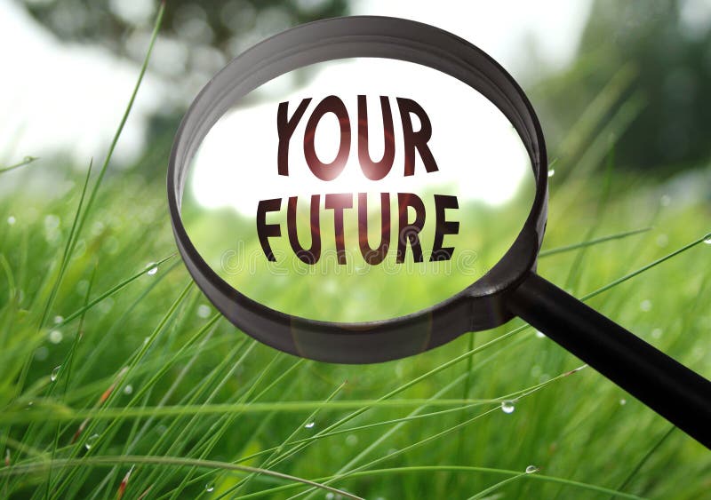 Magnifying glass with the word your future on grass background. Selective focus. Magnifying glass with the word your future on grass background. Selective focus