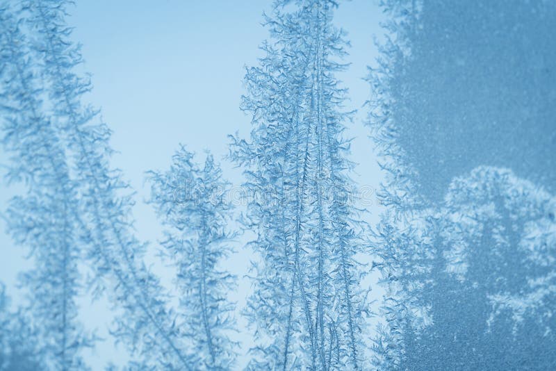 Ijzig cyaan blauw venster met sneeuwvlokpatronen royalty-vrije stock afbeelding Ijzig cyaan blauw venster met sneeuwvlokpatronen royalty-vrije stock afbeelding