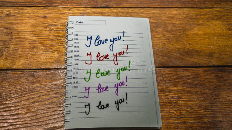 I love you, writing love text on paper, lovely message. Text on spiral agenda. Romantic, love concept. Valentine`s day. I love you, writing love text on paper, lovely message. Text on spiral agenda. Romantic, love concept. Valentine`s day