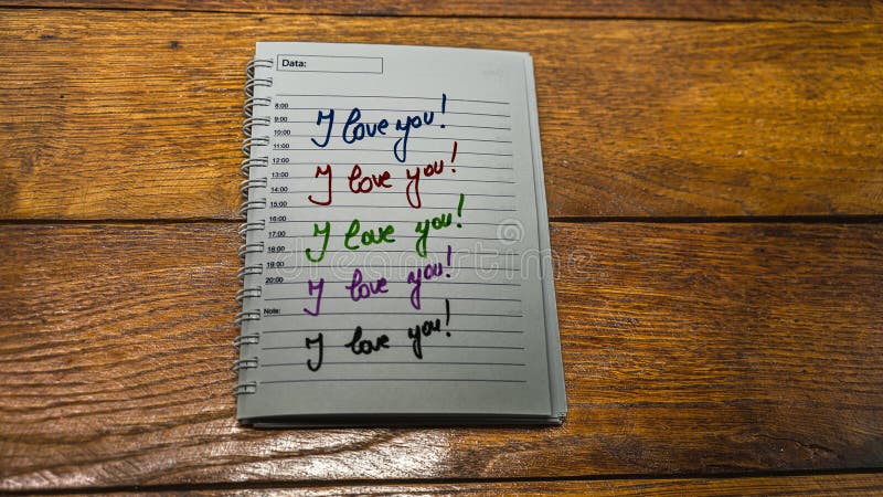 I love you, writing love text on paper, lovely message. Text on spiral agenda. Romantic, love concept. Valentine`s day. I love you, writing love text on paper, lovely message. Text on spiral agenda. Romantic, love concept. Valentine`s day