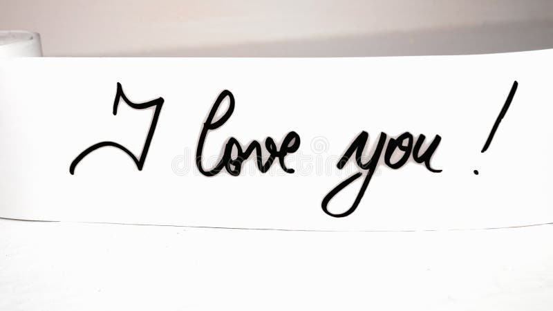 I love you handwriting text on paper. Label tag with lovely message. Romantic love concept for Valentine`s day. I love you handwriting text on paper. Label tag with lovely message. Romantic love concept for Valentine`s day