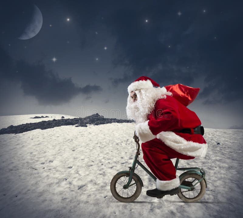 Il Babbo Natale sulla bici fotografia stock libera da diritti Il Babbo Natale sulla bici fotografia stock libera da diritti