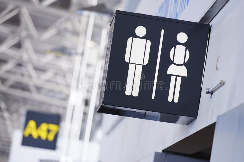 Il bagno firma dentro l'aeroporto fotografie stock Il bagno firma dentro l'aeroporto fotografie stock