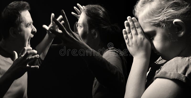 Child prays for peace in the family on the background of quarreling parents. Child prays for peace in the family on the background of quarreling parents.