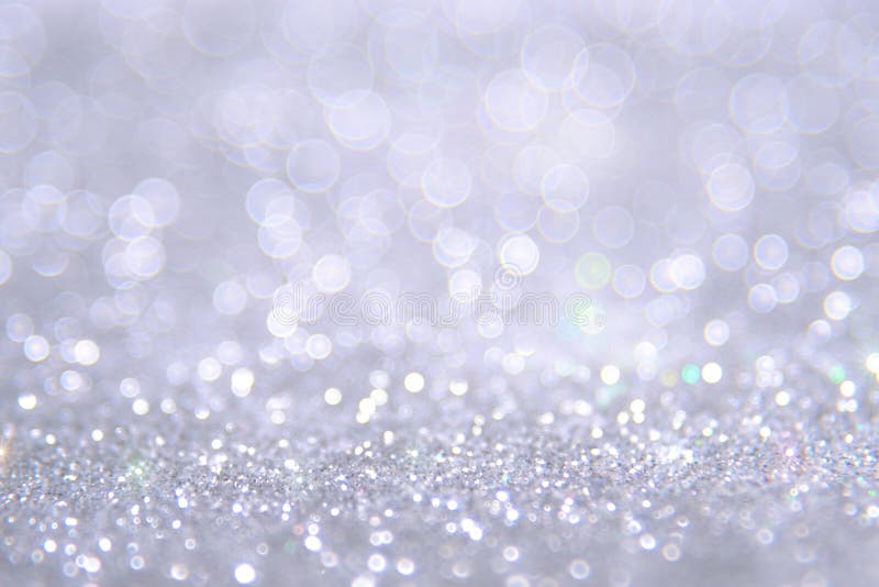 Il bokeh d'argento e bianco accende defocused sottragga la priorità bassa fotografia stock Il bokeh d'argento e bianco accende defocused sottragga la priorità bassa fotografia stock