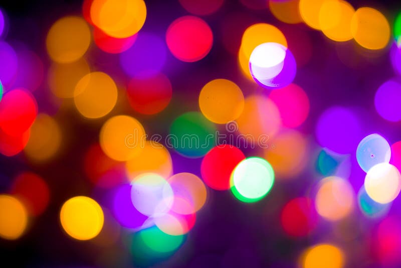 Il bokeh multicolore astratto Defocused accende il fondo Colori blu, porpora, verdi, arancio - concetto del nuovo anno e di natal immagine stock Il bokeh multicolore astratto Defocused accende il fondo Colori blu, porpora, verdi, arancio - concetto del nuovo anno e di natal immagine stock
