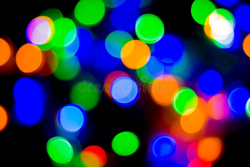 christmas and new year concept - Defocused abstract multicolored bokeh lights background. Blue, purple, green, orange colors. christmas and new year concept - Defocused abstract multicolored bokeh lights background. Blue, purple, green, orange colors.