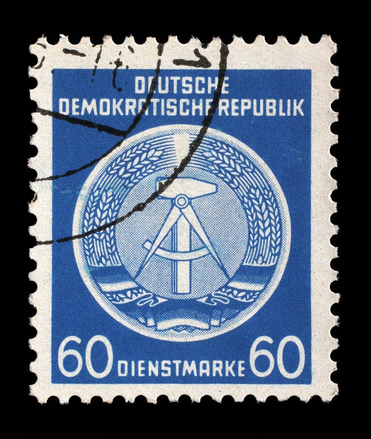 Il bollo stampato nel GDR mostra la stemma del cittadino della RDT fotografia stock Il bollo stampato nel GDR mostra la stemma del cittadino della RDT fotografia stock