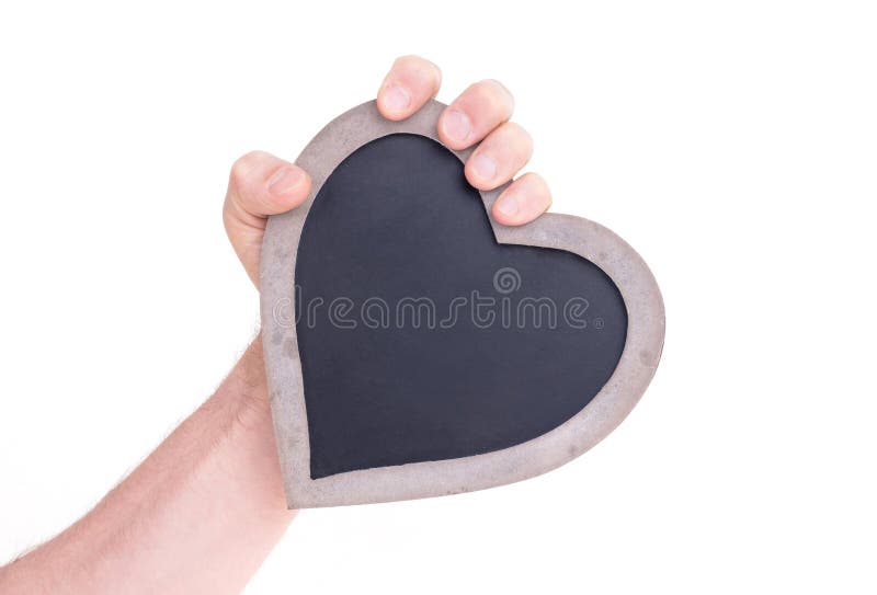 Il cuore adulto della tenuta ha modellato la lavagna - leggermente arrabbiata fotografia stock libera da diritti Il cuore adulto della tenuta ha modellato la lavagna - leggermente arrabbiata fotografia stock libera da diritti