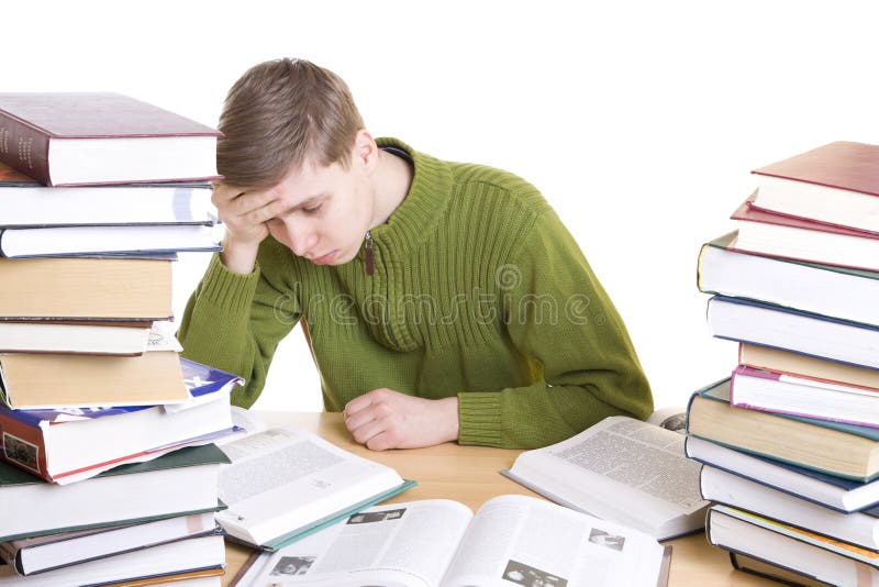 Il giovane allievo con i libri fotografia stock libera da diritti Il giovane allievo con i libri fotografia stock libera da diritti