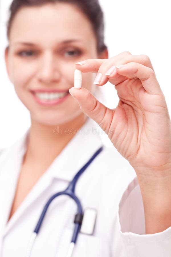 Il medico propone una pillola. fotografia stock libera da diritti Il medico propone una pillola. fotografia stock libera da diritti