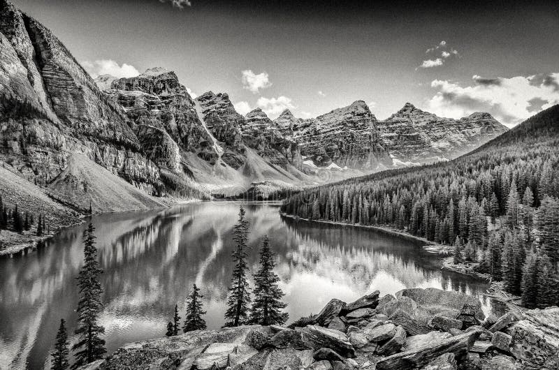 Monochrome filtered landscape view of Moraine lake and mountain range in Canadian Rocky Mountains. Monochrome filtered landscape view of Moraine lake and mountain range in Canadian Rocky Mountains