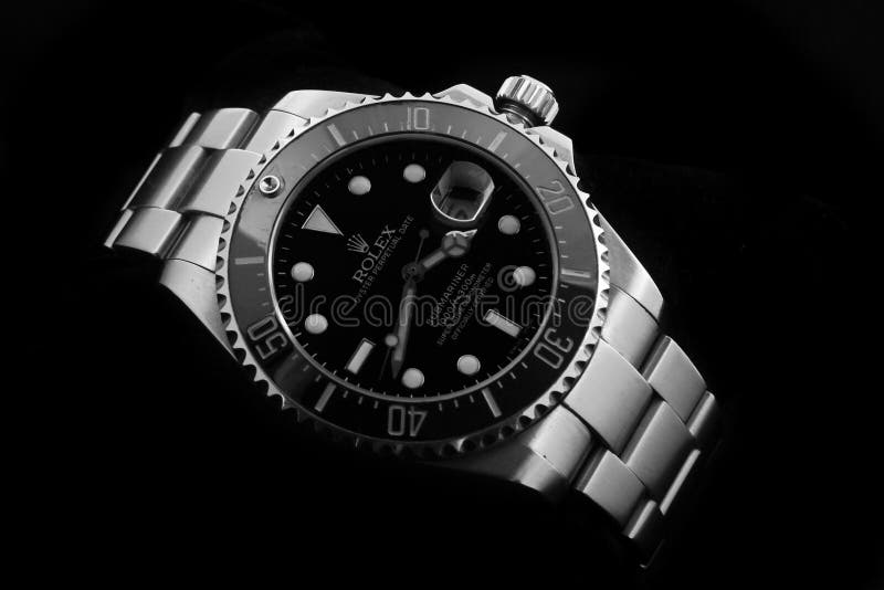 Rolex Oyster Perpetual Submariner Black in Black Clear Background. The Rolex Oyster Perpetual Datejust is a certified, self-winding chronometer wristwatch manufactured by Rolex. Rolex Oyster Perpetual Submariner Black in Black Clear Background. The Rolex Oyster Perpetual Datejust is a certified, self-winding chronometer wristwatch manufactured by Rolex.