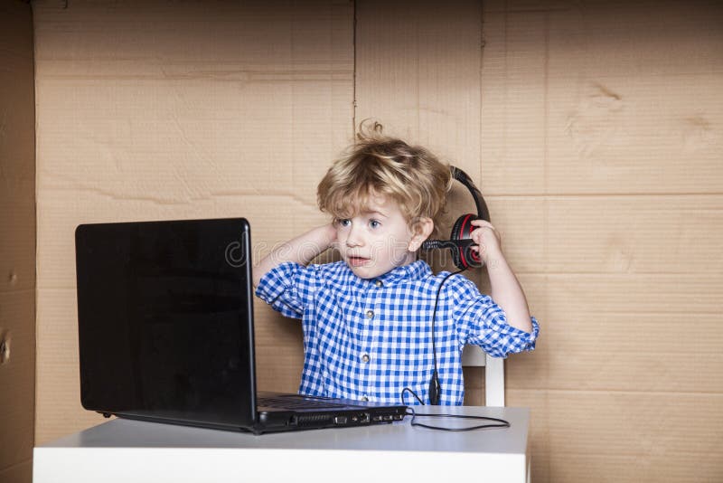 Small businessman removes headphones, hard working in the office. Small businessman removes headphones, hard working in the office