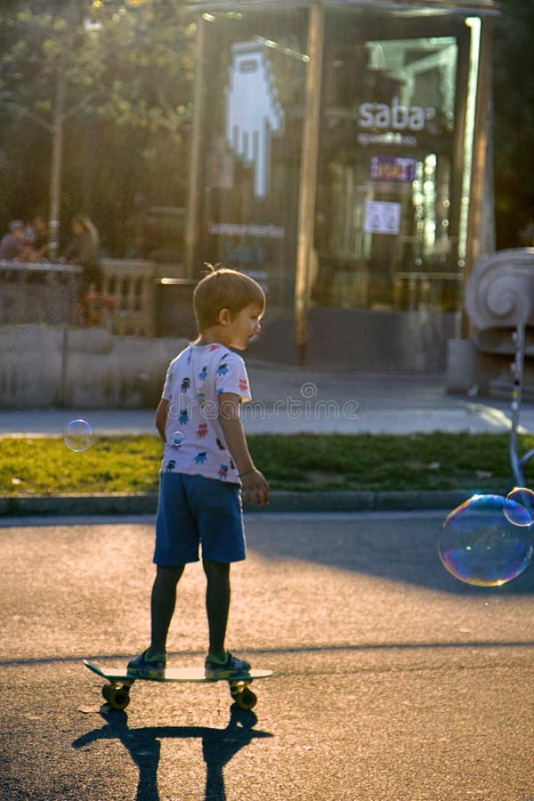 Barcelona, Spain - October 9, 2017: Public walks on Boulevard among soap bubbles different shape and size. Urban entertainment. Barcelona, Spain - October 9, 2017: Public walks on Boulevard among soap bubbles different shape and size. Urban entertainment