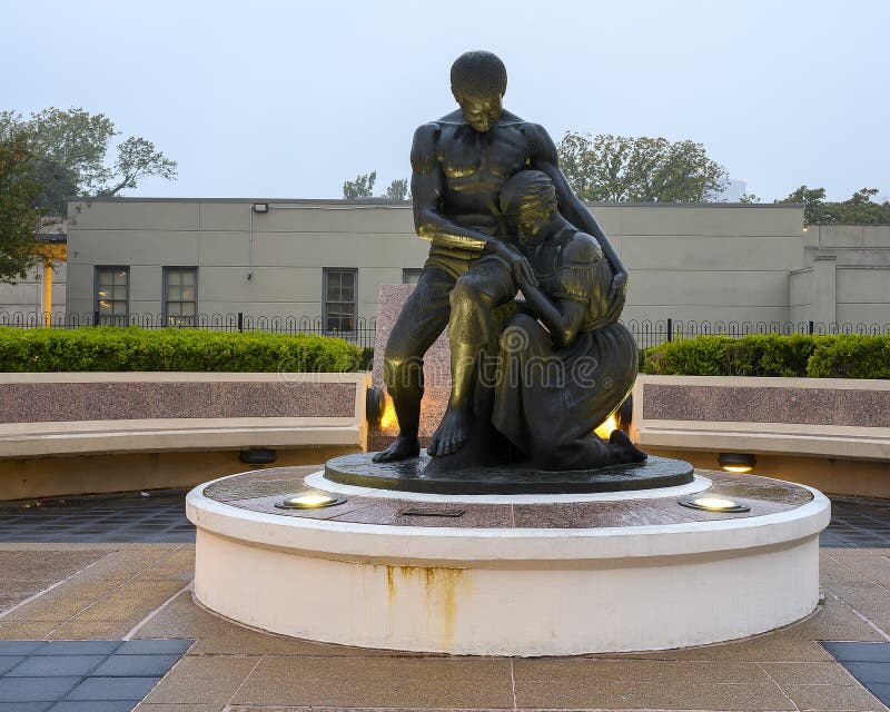 Pictured is a bronze sculpture titled `The Dream of Freedom` by David Newton inside the Freedman`s Cemetery Memorial in Dallas, Texas.  David Newton is an American sculptor and artist who was selected after a national search for the commission for the Memorial.  The statue is a symbolic of a newly emancipated couple contemplating the death and suffering of their ancestors. Pictured is a bronze sculpture titled `The Dream of Freedom` by David Newton inside the Freedman`s Cemetery Memorial in Dallas, Texas.  David Newton is an American sculptor and artist who was selected after a national search for the commission for the Memorial.  The statue is a symbolic of a newly emancipated couple contemplating the death and suffering of their ancestors.