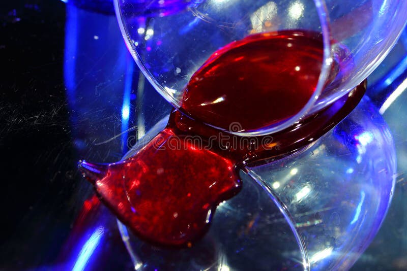 Dissonance. The bottled wine. The fallen glass. Blue color and red wine. Incongruous, unsuitable colors. Dissonance. The bottled wine. The fallen glass. Blue color and red wine. Incongruous, unsuitable colors.