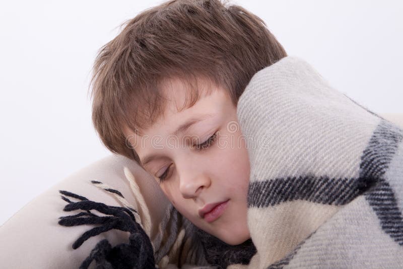 The ill boy Has fallen asleep in an armchair