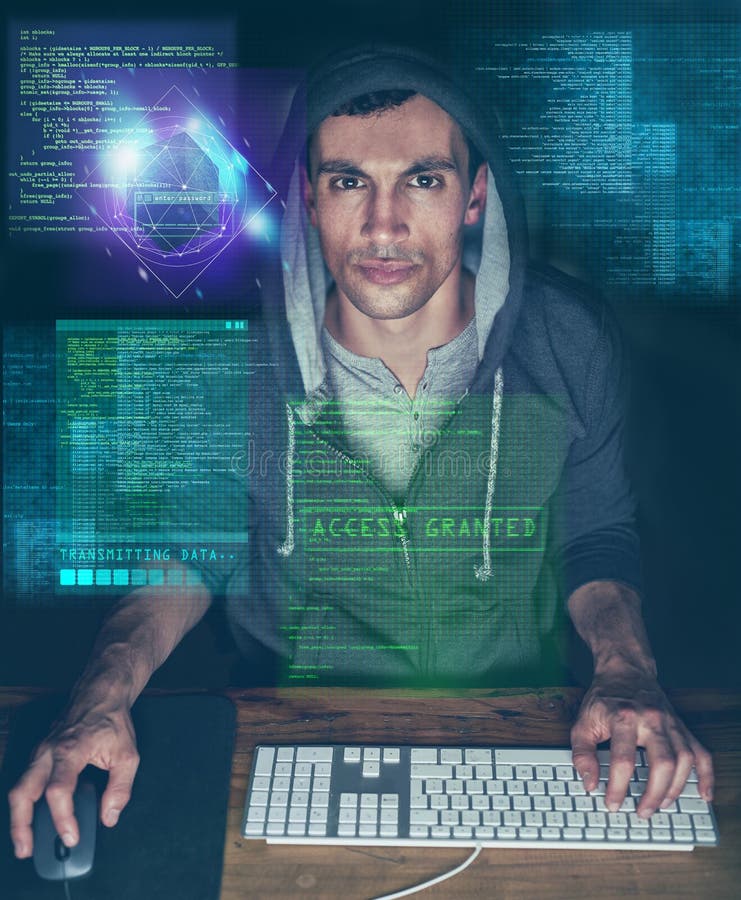 Ill make this deadline if it takes me all night. a young programmer working on his computer late at night. stock photo