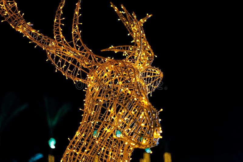 Illuminated deer sculpture with twinkling lights stock photography