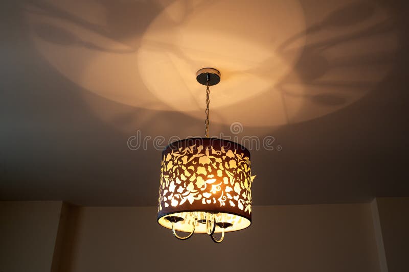 An illuminated lamp on back background. Luxury, decorative.