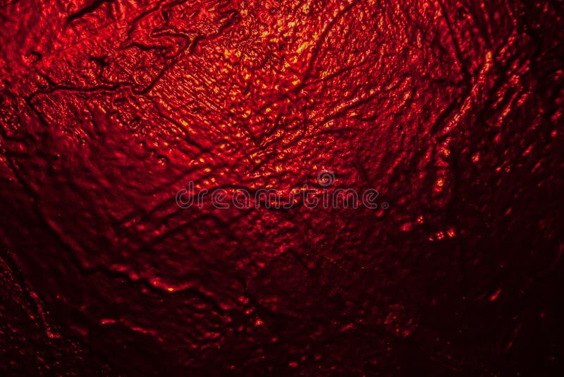 Illuminated in red black texture wall as a background royalty free stock images