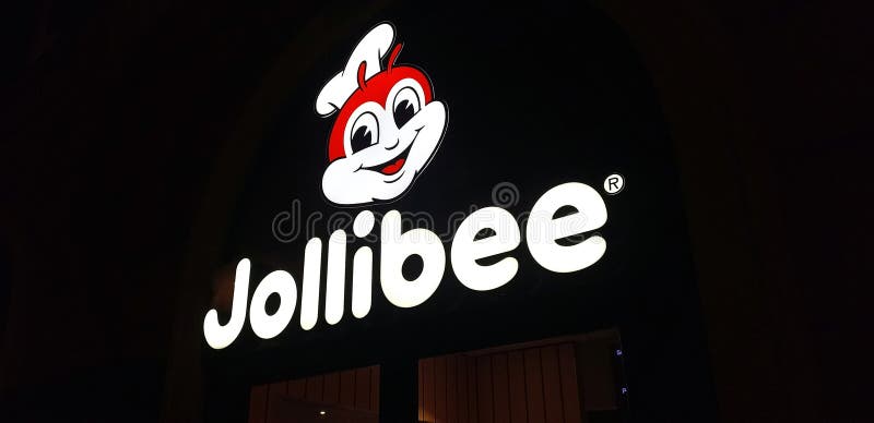 Illuminated Sign Of A Roman Branch Of The Filipino Fast Food Chain