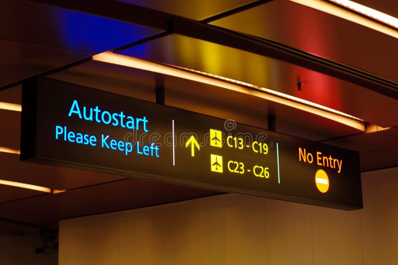 Illuminated travelator and directional signs