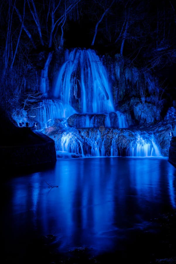 Illuminated waterfall Lucky with blue light at night. Slovakia