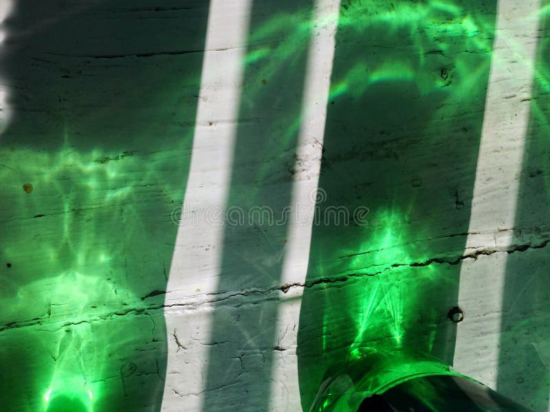 Illusion of Sunlight, Light Passes through a Plastic Bottle. Stock Photo Image of table, floor