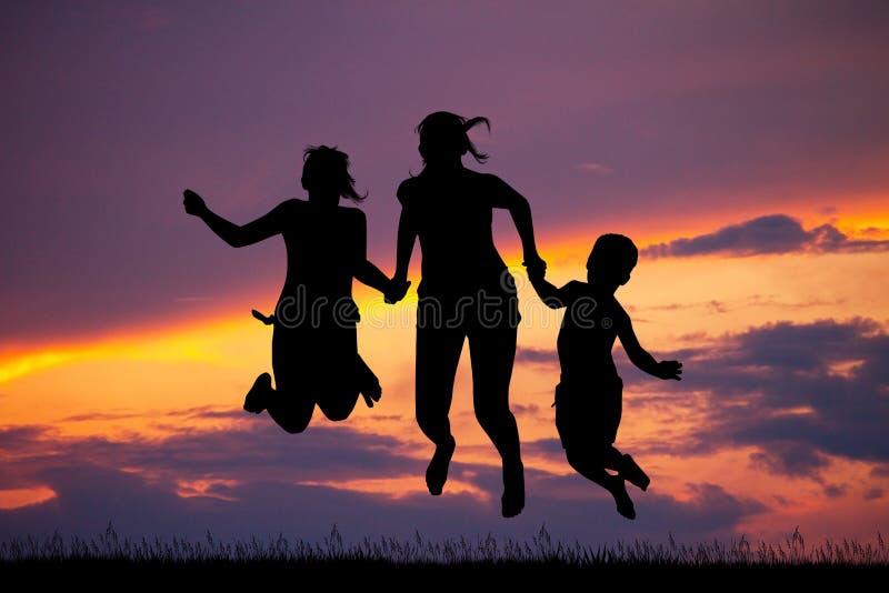 Happy boys and girls at sunset