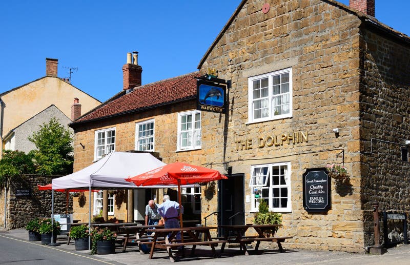 ILMINSTER, UK - September 04, 2023 - Front view of the Dolphin Inn along Silver Street in the town centre, Ilminster, Somerset, UK, Europe, September 04, 2023. ILMINSTER, UK - September 04, 2023 - Front view of the Dolphin Inn along Silver Street in the town centre, Ilminster, Somerset, UK, Europe, September 04, 2023